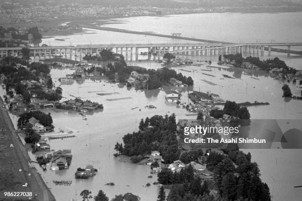 In this aerial image, Kitakamigawa River is flooded after the heavy rain on August 18, 1987 in Ichinoseki, Iwate, Japan.