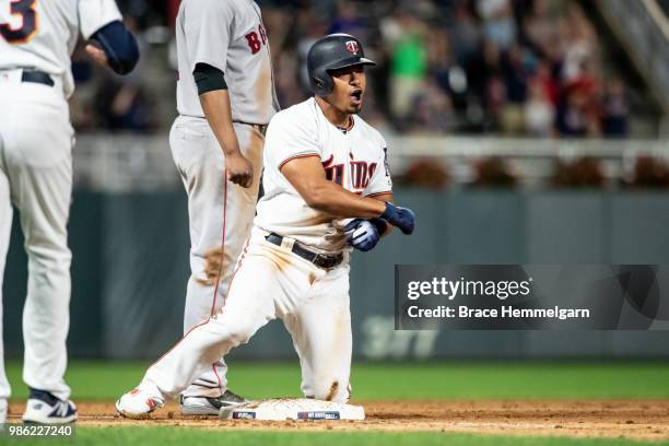 Eduardo Escobar of the Minnesota Twins celebrates against the Boston Red Sox on June 19, 2018 at Target Field in Minneapolis, Minnesota. The Twins...