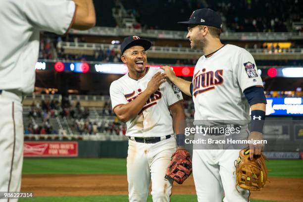 Eduardo Escobar of the Minnesota Twins laughs with Brian Dozier against the Boston Red Sox on June 19, 2018 at Target Field in Minneapolis,...