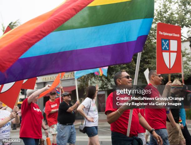 Andres Hernandez, of Santa Ana, marches with The Episcopal Church during OC Pride"u2019s "Blaze Forward" Pride Parade in Santa Ana on Saturday, June...