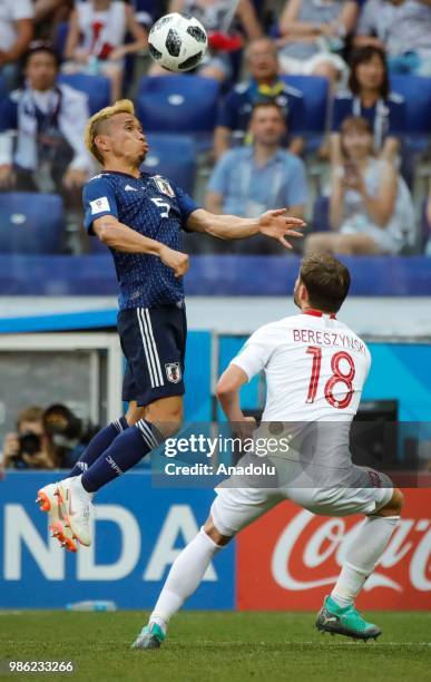 Yuto Nagatomo of Japan in action against Bartosz Bereszynski of Poland during the 2018 FIFA World Cup Russia Group H match between Japan and Poland...