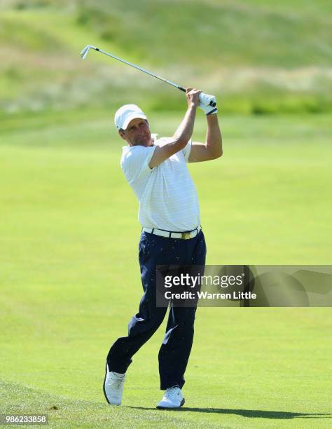 Jose Maria Olazabal of Spain plays his second shot on the 10th hole during the first round of the HNA Open de France at Le Golf National on June 28,...