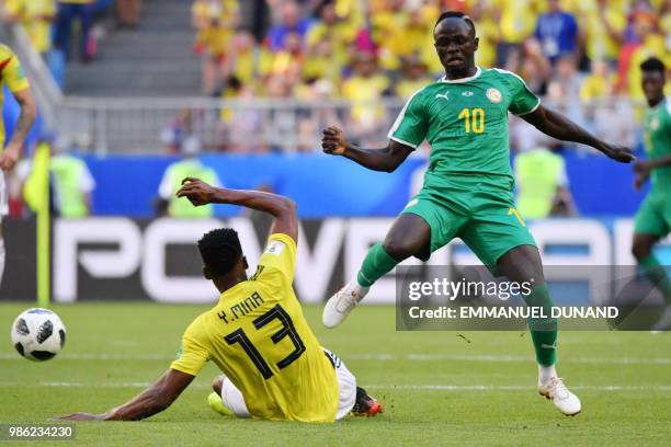 Senegal's forward Sadio Mane challenges Colombia's defender Yerry Mina during the Russia 2018 World Cup Group H football match between Senegal and...