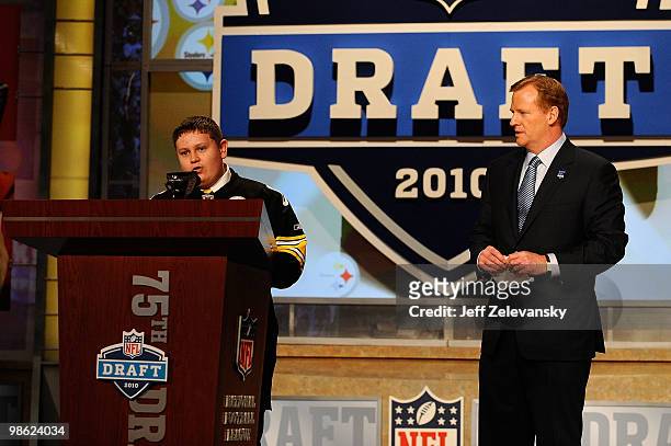 Commissioner Roger Goodell looks watches as 16-year old Zachary Hatfield from Florence, KY announces that Maurkice Pouncey from the Florida Gators...
