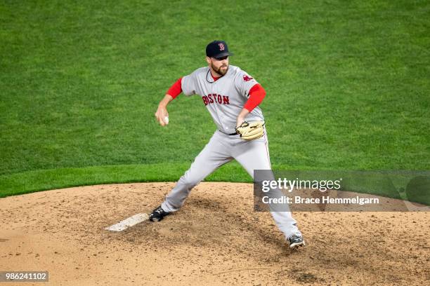 Heath Hembree of the Boston Red Sox pitches against the Minnesota Twins on June 20, 2018 at Target Field in Minneapolis, Minnesota. The Twins...