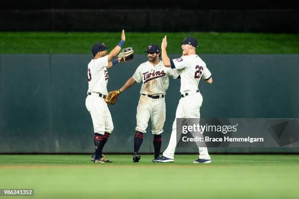 Eddie Rosario, Ryan LaMarre and Max Kepler of the Minnesota Twins celebrate against the Boston Red Sox on June 20, 2018 at Target Field in...