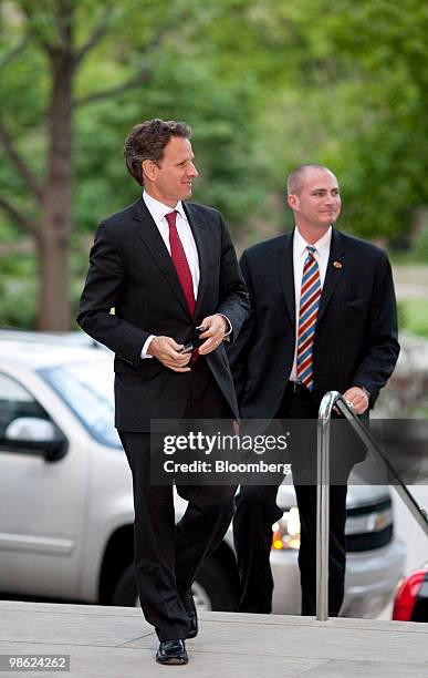 Timothy Geithner, U.S. Treasury secretary, left, arrives at the Canadian embassy for a dinner with the finance ministers and central bankers of the...