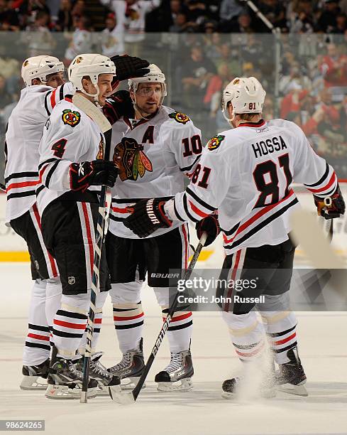 Niklas Hjalmarsson, Patrick Sharp, and Marian Hossa of the Chicago Blackhawks celebrate after scoring a goal against the Nashville Predators in Game...