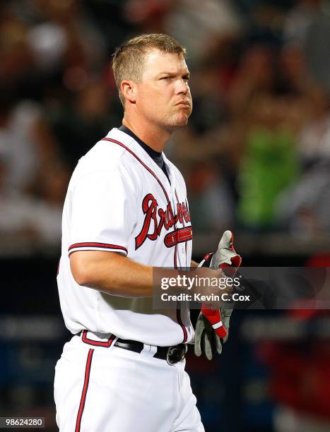 Chipper Jones of the Atlanta Braves reacts after lining out to third base against the Philiadelphia Phillies at Turner Field on April 22, 2010 in...