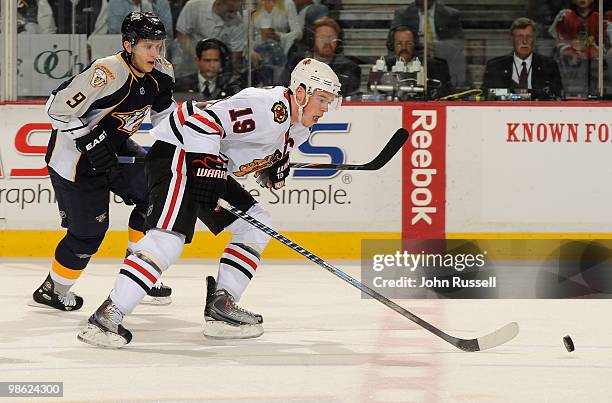 Marcel Goc of the Nashville Predators skates against Jonathan Toews of the Chicago Blackhawks in Game Four of the Western Conference Quarterfinals...