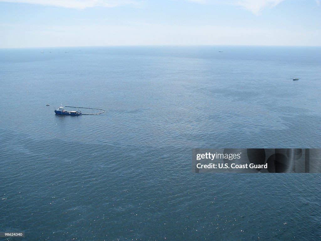 Response boats work to clean up oil where the Deepwater Horizon... News ...