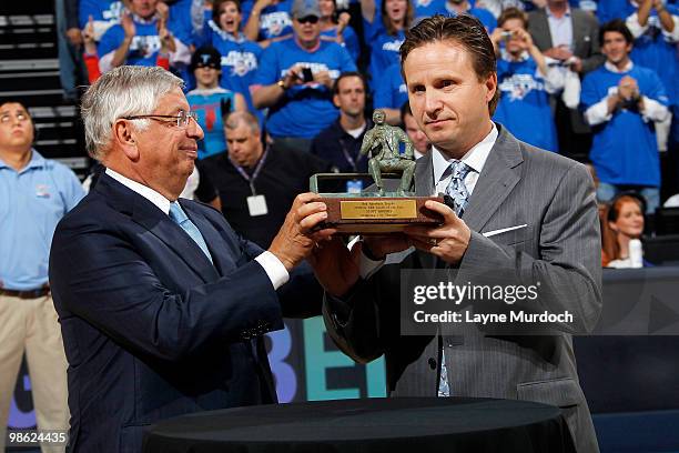 Commissioner, David Stern, hands the Red Auerbach Trophy to Scott Brooks, Head Coach of the Oklahoma City Thunder for the 2009-10 NBA Coach of the...