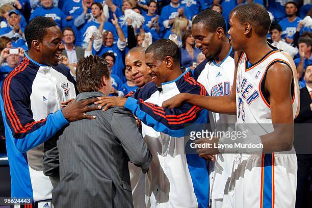 Scott Brooks, Head Coach of the Oklahoma City Thunder receives a group hug from Thunder players Jeff Green, Kevin Ollie, Eric Maynor, Serge Ibaka and...