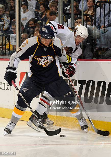Martin Erat of the Nashville Predators skates against Duncan Keith of the Chicago Blackhawks in Game Four of the Western Conference Quarterfinals...