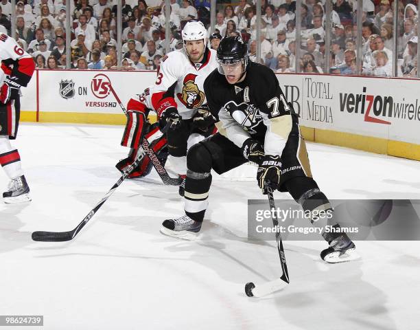 Evgeni Malkin of the Pittsburgh Penguins moves the puck in front of Jarkko Ruutu of the Ottawa Senators in Game Five of the Eastern Conference...