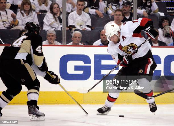 Mike Fisher of the Ottawa Senators handles the puck in front of Brooks Orpik of the Pittsburgh Penguins during the second overtime period in Game...