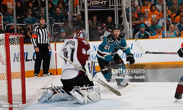 Craig Anderson of the Colorado Avalanche makes a save against Scott Nichol of the San Jose Sharks in Game Five of the Western Conference...