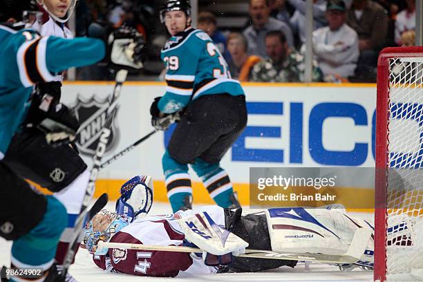 Goalie Craig Anderson of the Colorado Avalanche loses control of the puck as he ends up on his back. But the San Jose Sharks were not able to take...