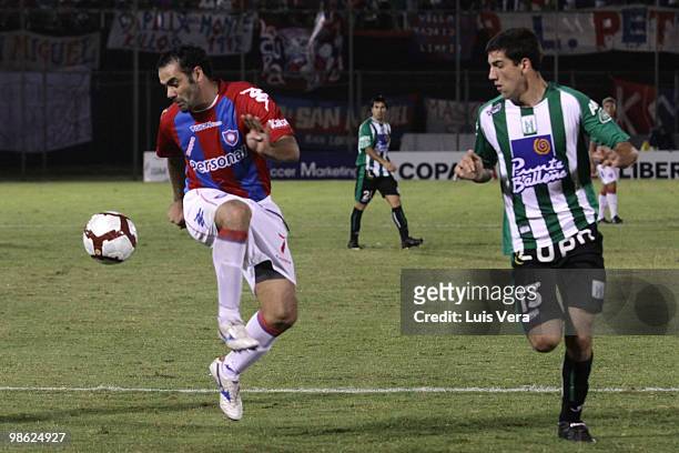 Cesar Ramirez of Paraguayan Cerro Porteno fights for the ball with Dany Tejera of Uruguayan Racing during a match as part of the 2010 Libertadores...