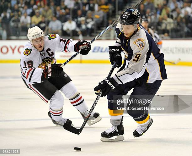 Jonathan Toewes of the Chicago Blackhawks defends against Marcel Goc of the Nashville Predators in Game Four of the Eastern Conference Quarterfinals...