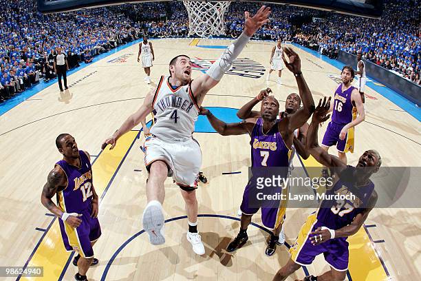 Nick Collison of the Oklahoma City Thunder fights Lamar Odom of the Los Angeles Lakers for a rebound in Game Three of the Western Conference...