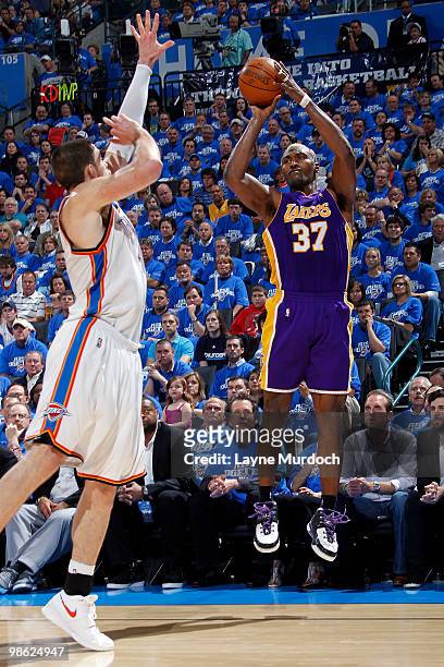 Ron Artest of the Los Angeles Lakers shoots a jump shot over Nick Collison of the Oklahoma City Thunder in Game Three of the Western Conference...
