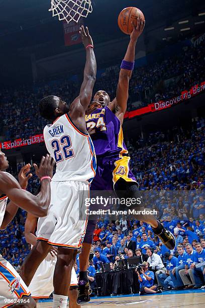 Kobe Bryant of the Los Angeles Lakers goes to the basket against Jeff Green of the Oklahoma City Thunder in Game Three of the Western Conference...