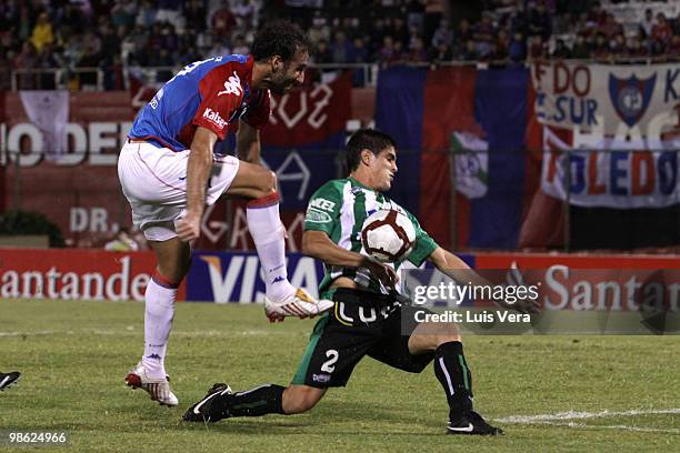 Roberto Nanni of Paraguayan Cerro Porteno fights for the ball with Rodrigo Brasesco of Uruguayan Racing during a match as part of the 2010...