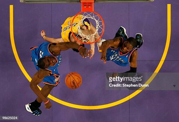 Jordan Farmar of the Los Angeles Lakers goes up for the ball against Serge Ibaka and Kevin Durant of the Oklahoma City Thunder during Game Two of the...
