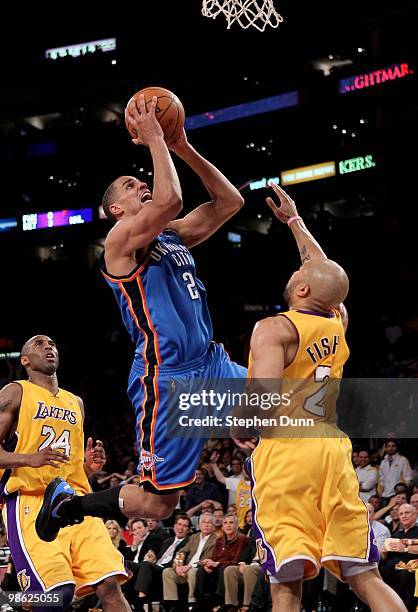 Thabo Sefolosha of the Oklahoma City Thunder shoots over Derek Fisher of the Los Angeles Lakers during Game Two of the Western Conference...