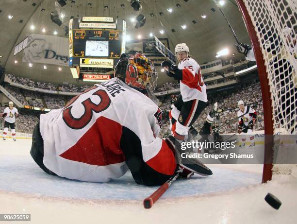 Pascal Leclaire of the Ottawa Senators can't stop a shot by Sidney Crosby of the Pittsburgh Penguins in Game Five of the Eastern Conference...