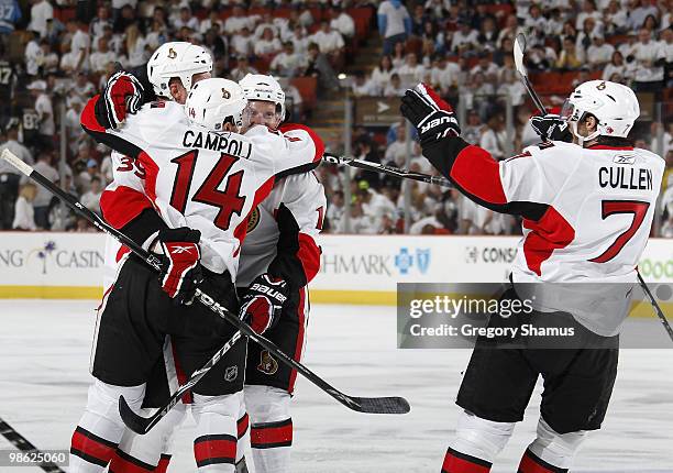 Matt Carkner of the Ottawa Senators celebrates his game winning goal with teammates against the Pittsburgh Penguins in Game Five of the Eastern...