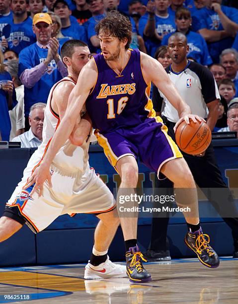 Pau Gasol of the Los Angeles Lakers dribbles to the basket against Nick Collison of the Oklahoma City Thunder in Game Three of the Western Conference...