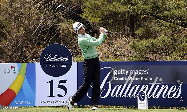 Brett Rumford of Australia tees off on the 15th hole during the fog-delayed Round One of the Ballantine's Championship at Pinx Golf Club on April 23,...