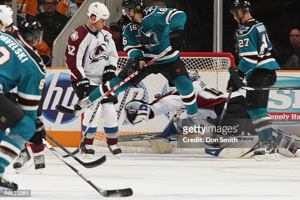 Craig Anderson and Adam Foote of the Colorado Avalanche watch a goal by Joe Pavelski of the San Jose Sharks as Devin Setoguchi and Manny Malhotra...