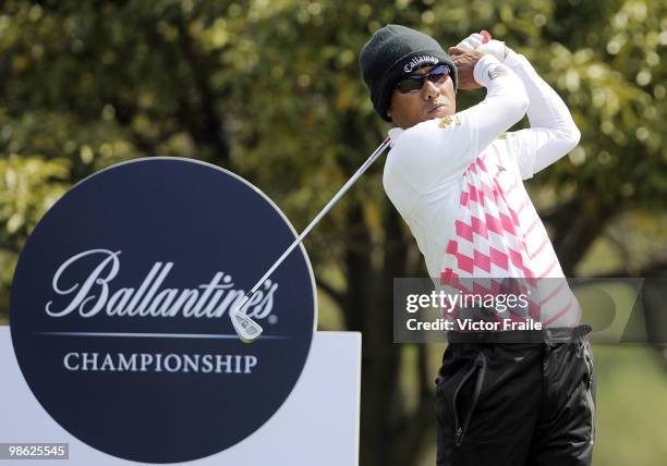 Thongchai Jaidee of Thailand tees off on the 14th hole during the fog-delayed Round One of the Ballantine's Championship at Pinx Golf Club on April...