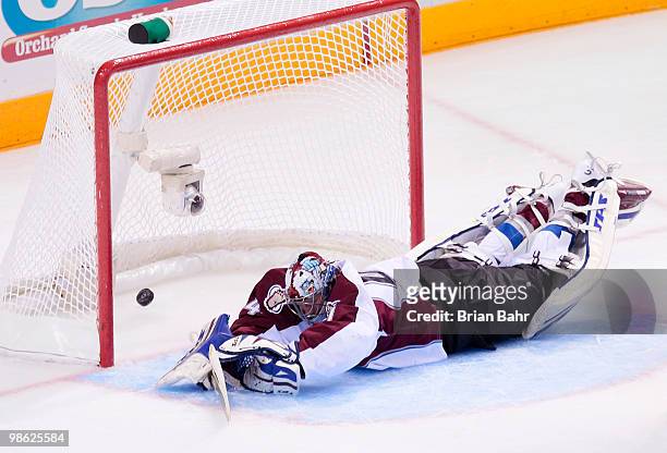 Goalie Craig Anderson of the Colorado Avalanche dives too late to stop a goal by Joe Pavelski of the San Jose Sharks after slipping on the far side...