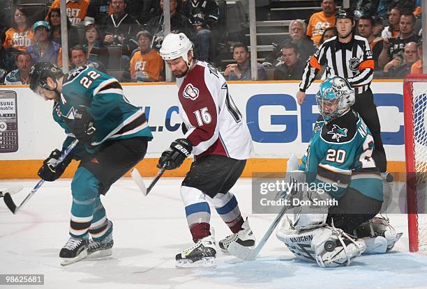 Darcy Tucker of the Colorado Avalanche tries to find the shot against Dan Boyle and Evgeni Nabokov of the San Jose Sharks in Game Five of the Western...