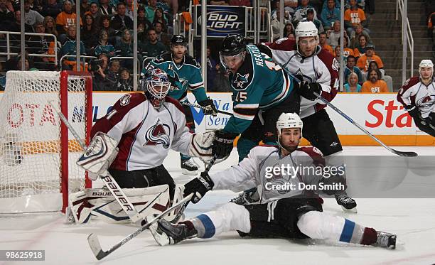 Craig Anderson, Kyle Quincey 27 and Ryan Wilson of the Colorado Avalanche defend the net against Dany Heatley and Patrick Marleau of the San Jose...