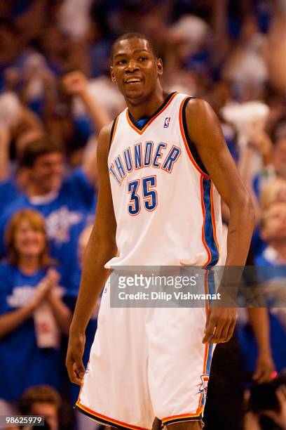Kevin Durant of the Oklahoma City Thunder smiles after hitting a three-point shot against the Los Angeles Lakers during Game Three of the Western...