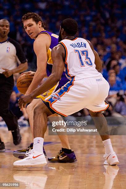 Luke Walton of the Los Angeles Lakers looks to get past James Harden of the Oklahoma City Thunder during Game Three of the Western Conference...