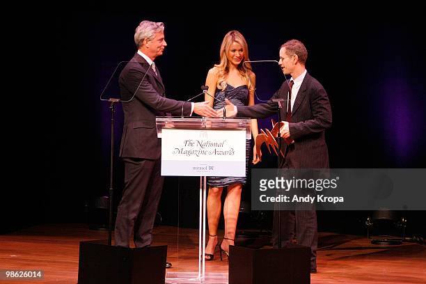 Managing editor of People magazine Larry Hackett and Katrina Bowden present an award to editor-in-chief of New York magazine Adam Moss at the 45th...