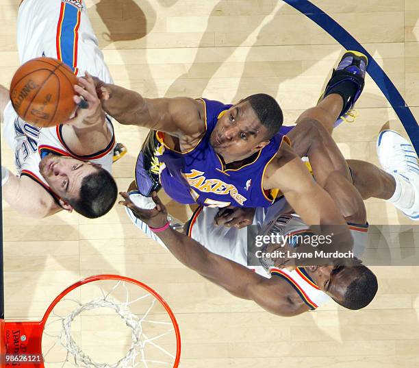 Nick Collison of the Oklahoma City Thunder grabs a rebound from Andrew Bynum of the Los Angeles Lakers in Game Three of the Western Conference...