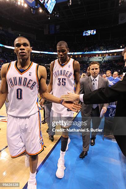 Coach Scott Brooks, Russell Westbrook and Kevin Durant of the Oklahoma City Thunder leave the court after a victory against the Los Angeles Lakers in...