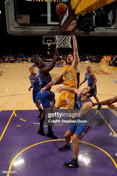 Pau Gasol of the Los Angeles Lakers shoots over Nenad Krstic and Jeff Green of the Oklahoma City Thunder during Game Two of the Western Conference...