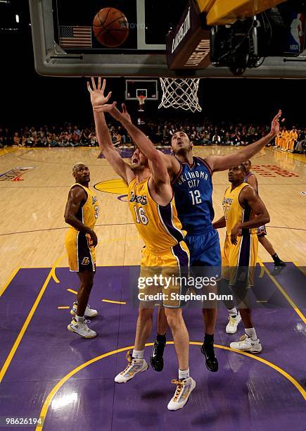 Pau Gasol of the Los Angeles Lakers goes for a rebound against Nenad Krstic of the Oklahoma City Thunder during Game Two of the Western Conference...