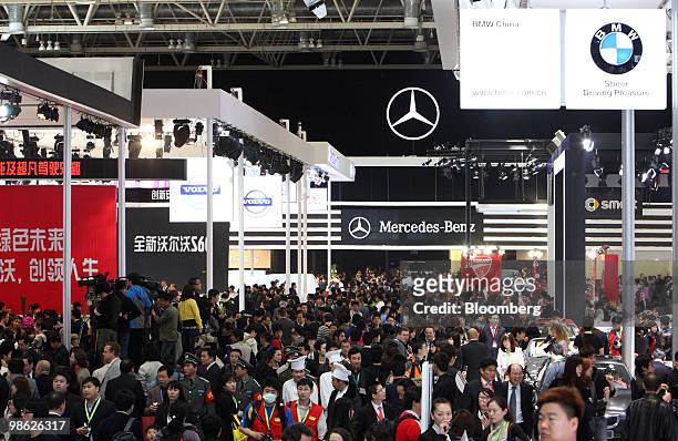 Visitors attend the Beijing Auto Show in Beijing, China, on Friday, April 23, 2010. Audi AG's two decades of dominance in China may end as Daimler AG...