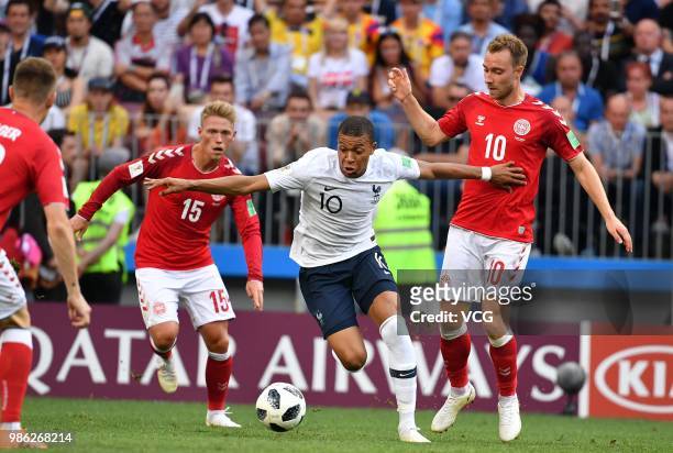 Christian Eriksen of Denmark and Kylian Mbappe of France compete for the ball during the 2018 FIFA World Cup Russia group C match between Denmark and...