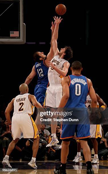 Pau Gasol of the Los Angeles Lakers jumps for a loose ball against Nenad Krstic of the Oklahoma City Thunder during Game One of the Western...