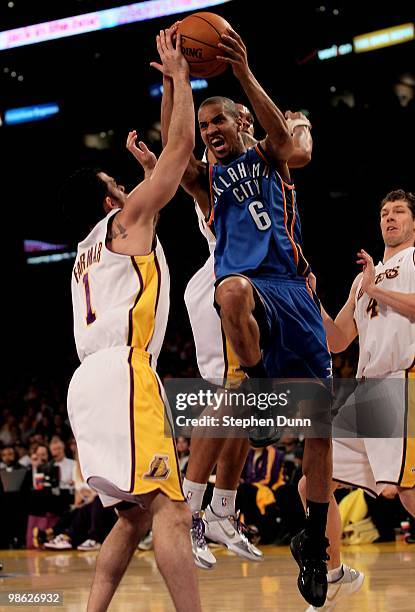 Eric Maynor of the Oklahoma City Thunder goes up for a shot over Jordan Farmar of the Los Angeles Lakers during Game One of the Western Conference...